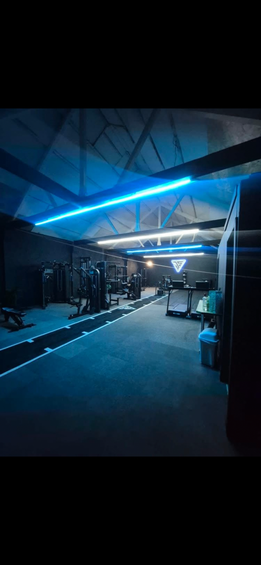 Jump Start 2.0 gym interior with signature blue neon lighting